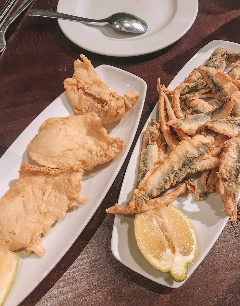 What to Eat in Malaga (Food Guide by a Local) 3 Fried anchovies and monkfish with lemon.