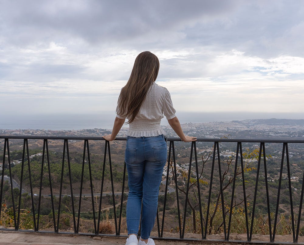 A woman contemplating the views from mijas pueblo.