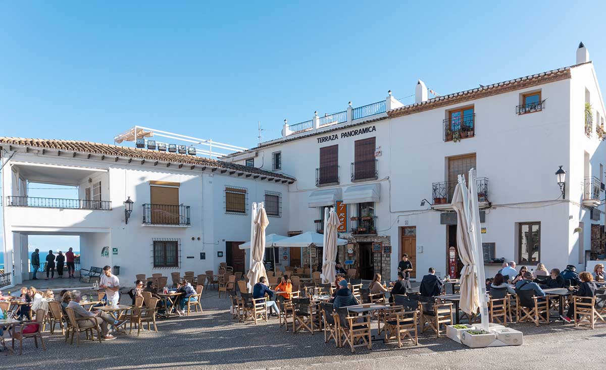 A square with outdoor seating in Altea.