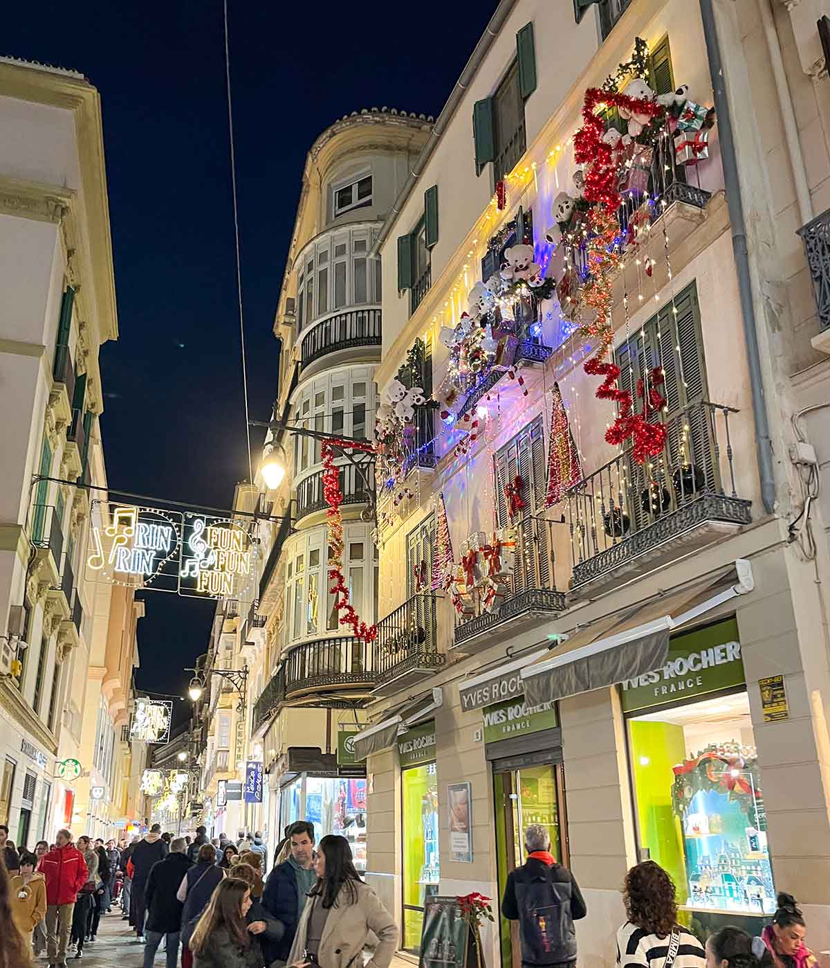 Balconies decorated with Christmas lights in Malaga city centre.