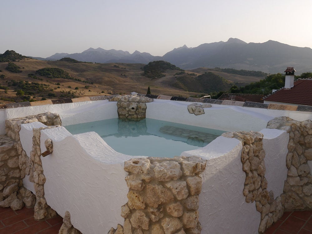 jacuzzi with mountain views at molino del abuelo guest house