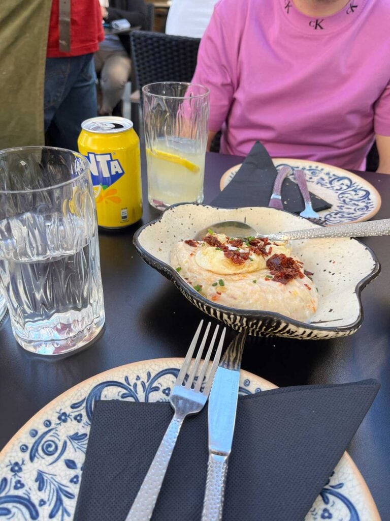 Russian Salad with fried egg and ham.