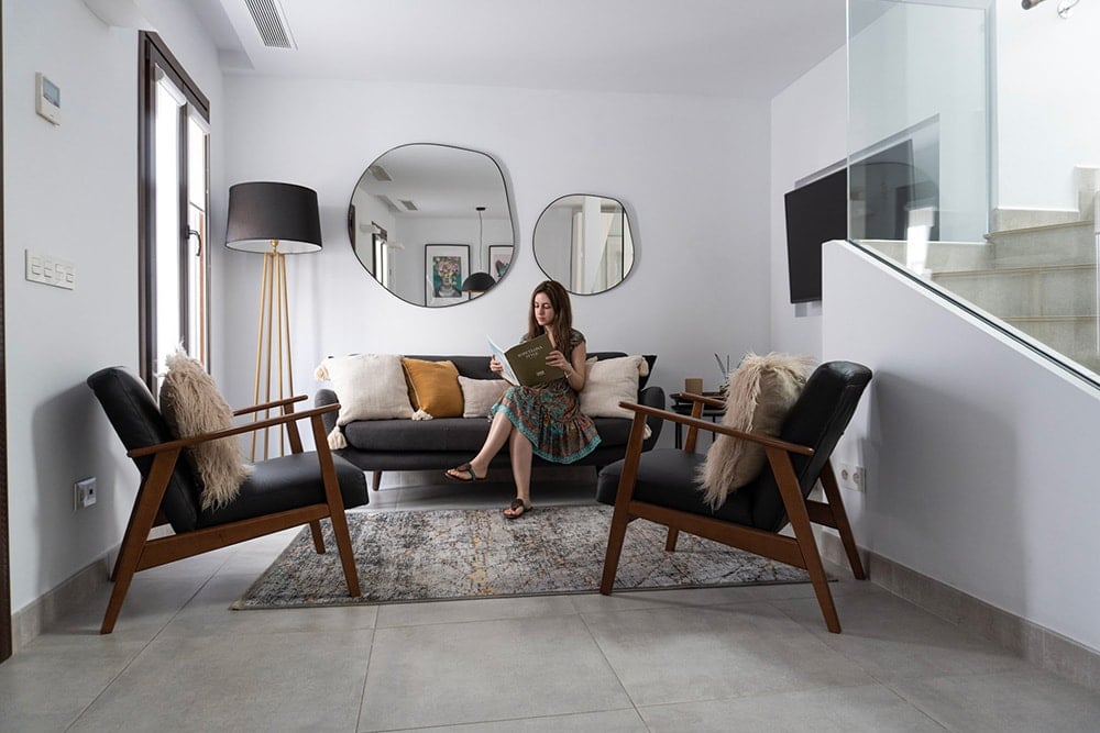 Woman reading a magazine in Casa Aduar 10, a luxury apartment in Marbella.