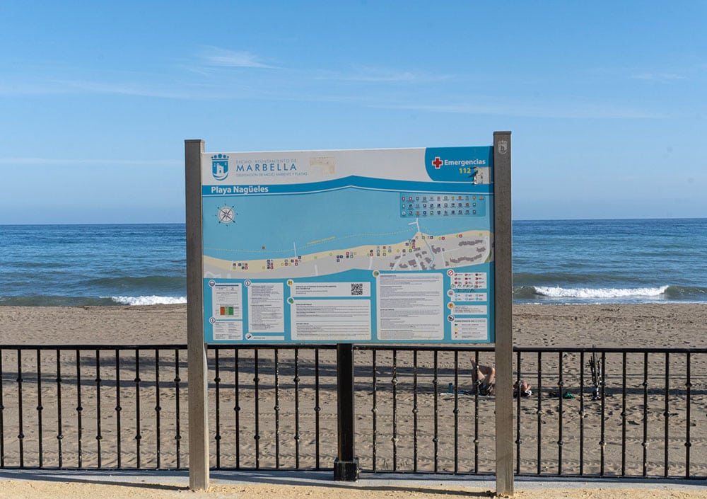 19 Beaches in Malaga Recommended By a Local 13 Beach sign at Nagueles Beach, Marbella.
