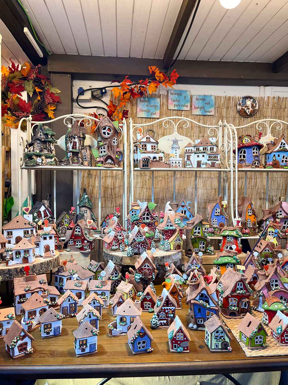 Ceramic small houses in a stall in muelle uno, malaga, spain.
