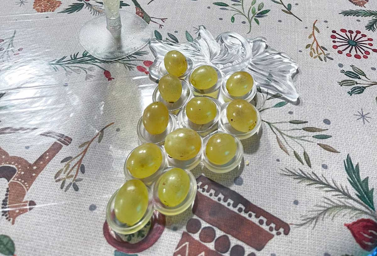 New Year's Eve in Malaga: Best Things to Do and Local Traditions 13 A close up photo of twelve green grapes.