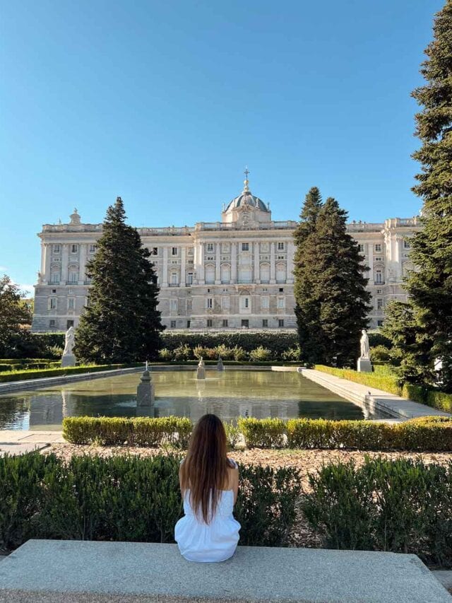 Cristina sat in a bench overlooking the Royal Palace in Madrid, Spain