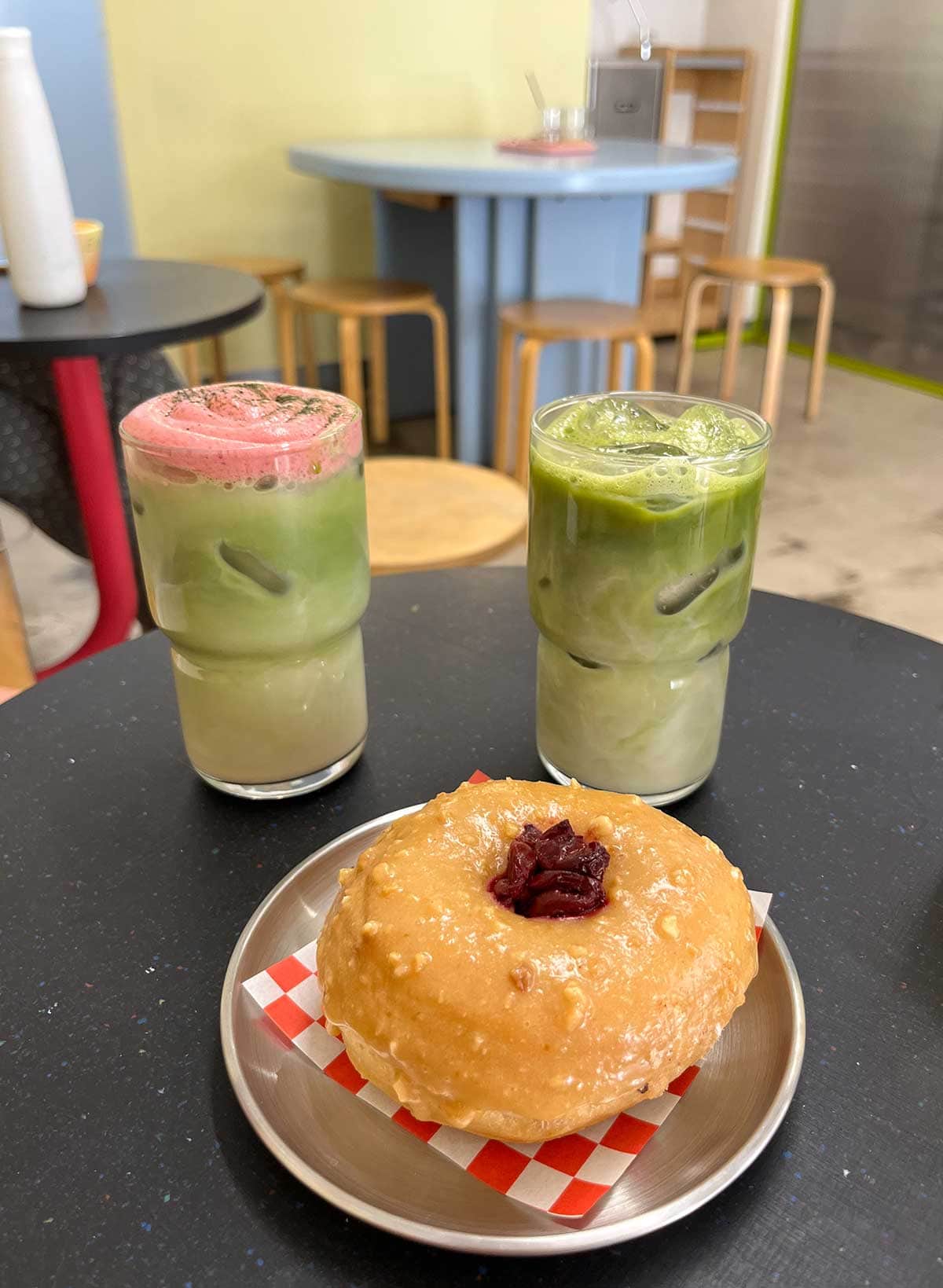 Peanut butter and cherry donut and two iced matcha lattes from Bun and Coffee in Malaga.