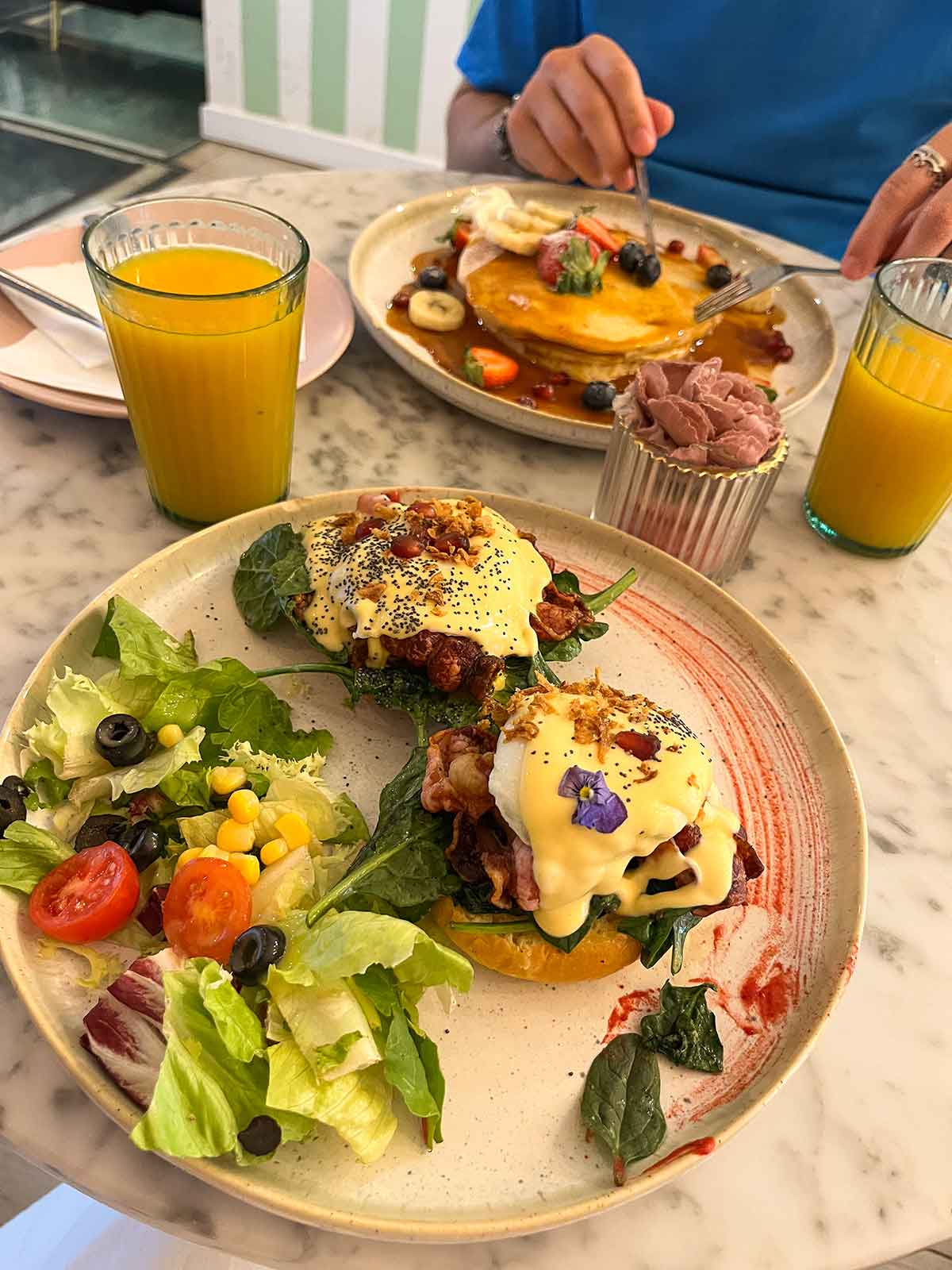 Eggs benedict and pancakes from Caramello Salato, Malaga.