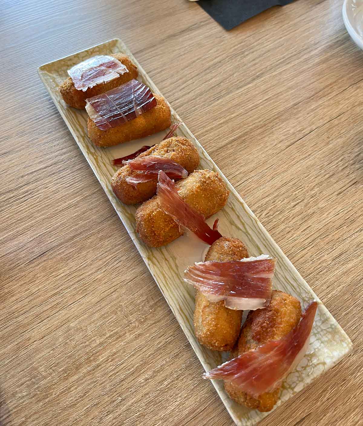 What to Eat in Malaga (Food Guide by a Local) 23 A plate with ham croquetas.