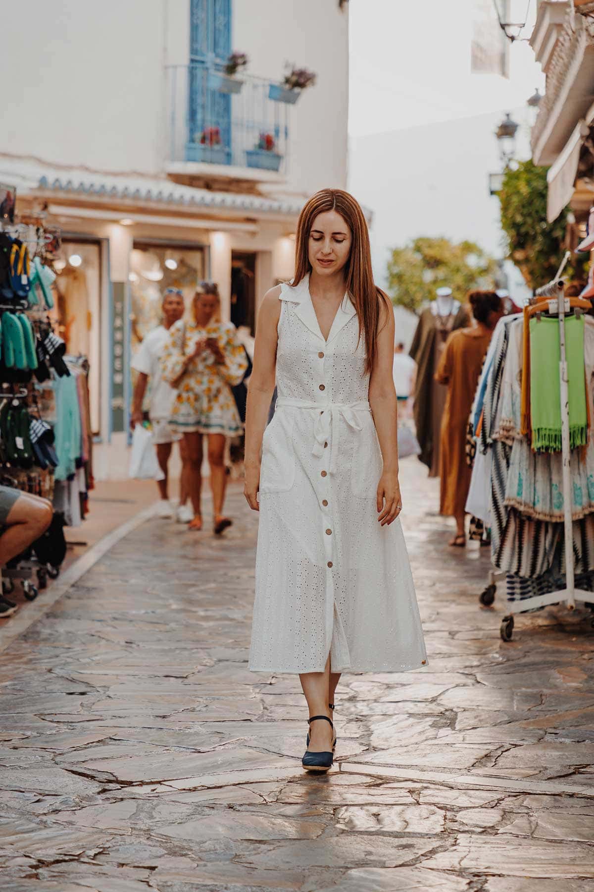 Cristina walking down Carmen Street in Marbella Old Town.