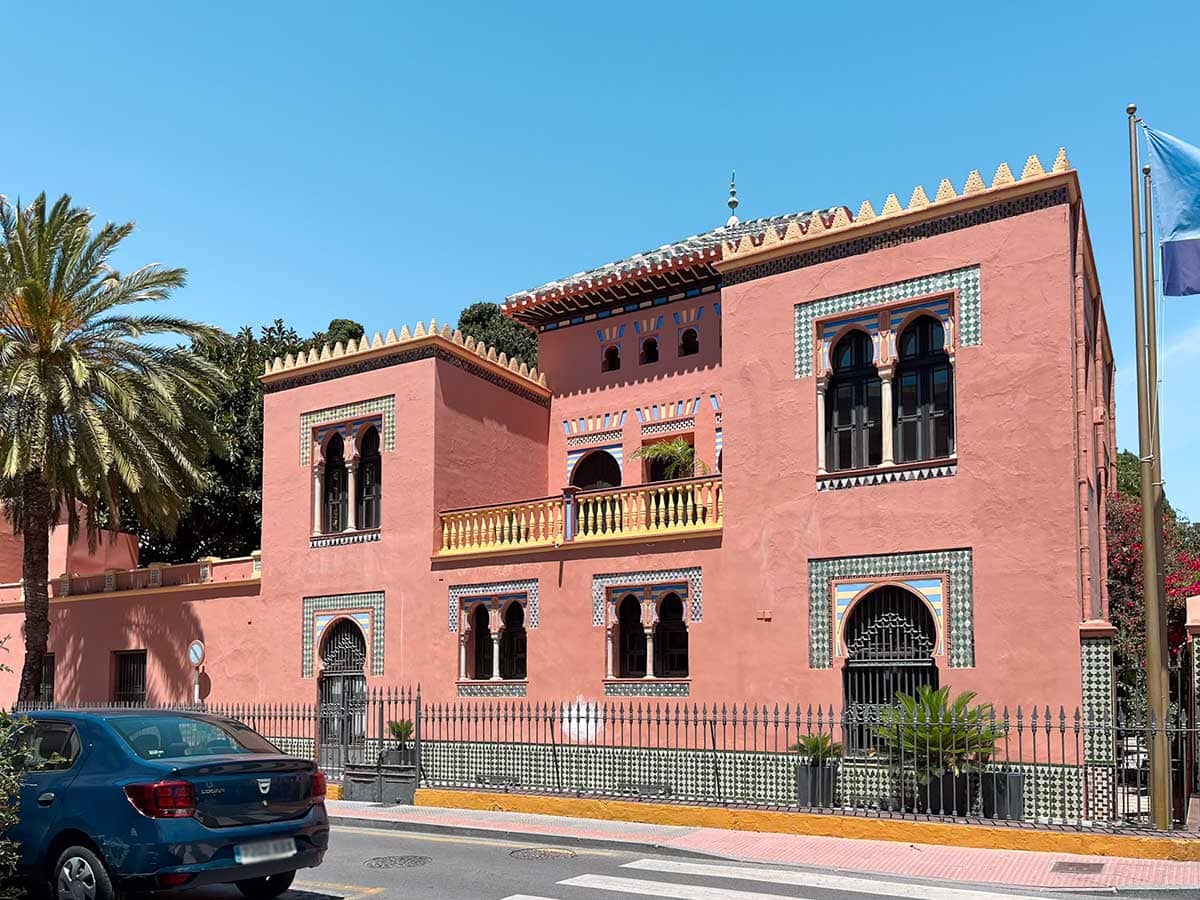 Almunecar tourist office pink sand  Moorish-style builiding.