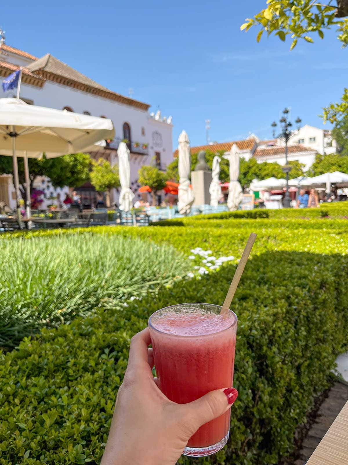 Cristina having a watermelon juice in Orange Square, Marbella.