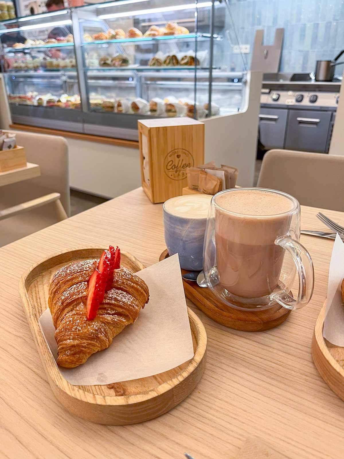 Croissant with fresh strawberries and custard from Kafein cafe in Marbella.