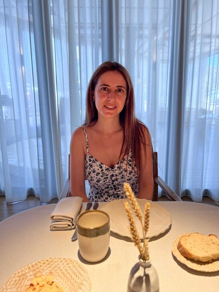 What to Do in Marbella When it Rains (13 Top Activities!) 4 Cristina waiting for her meal at Tragabuches Marbella.