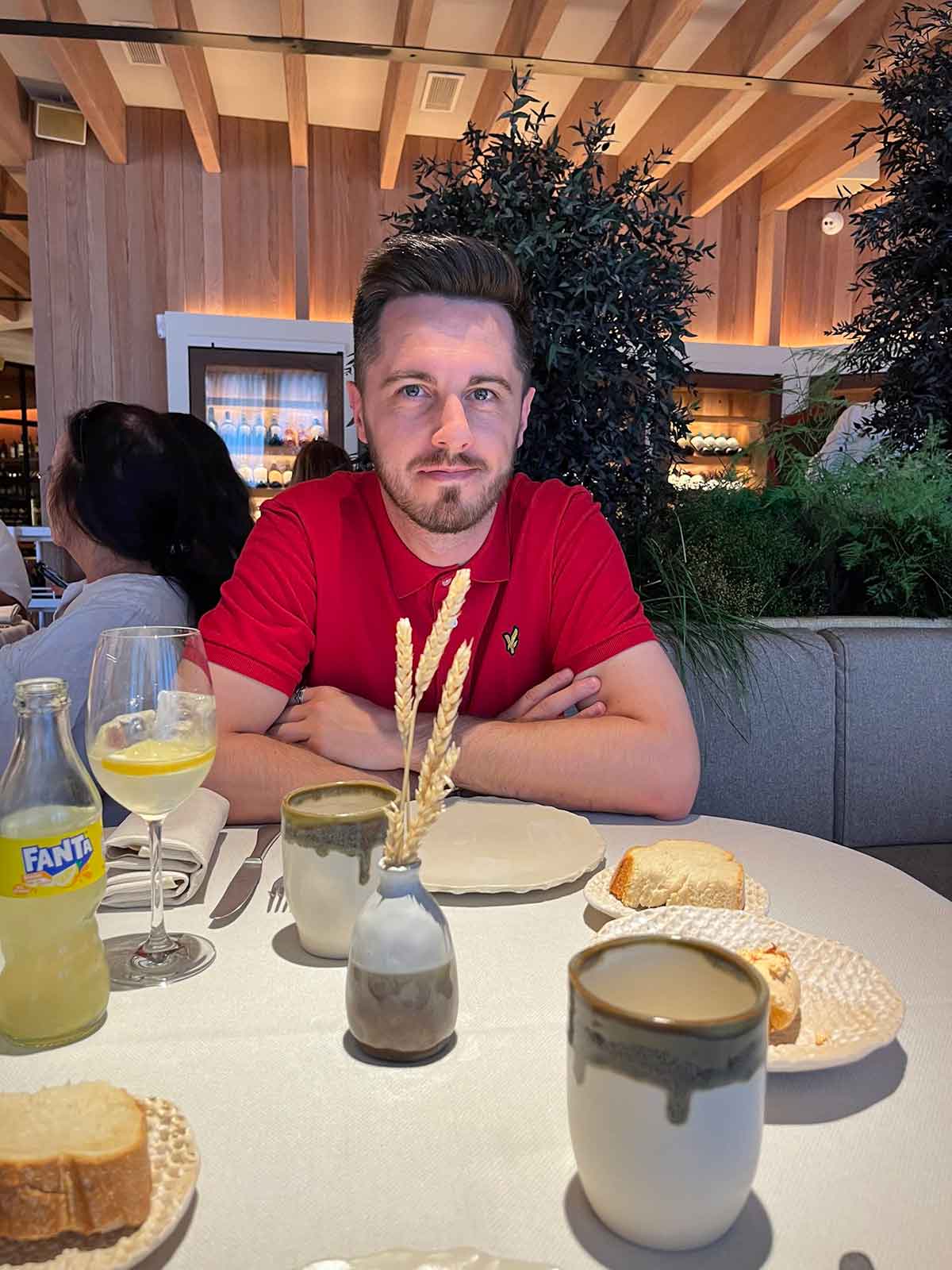 Man sat in Tragabuches restaurant waiting for his food.