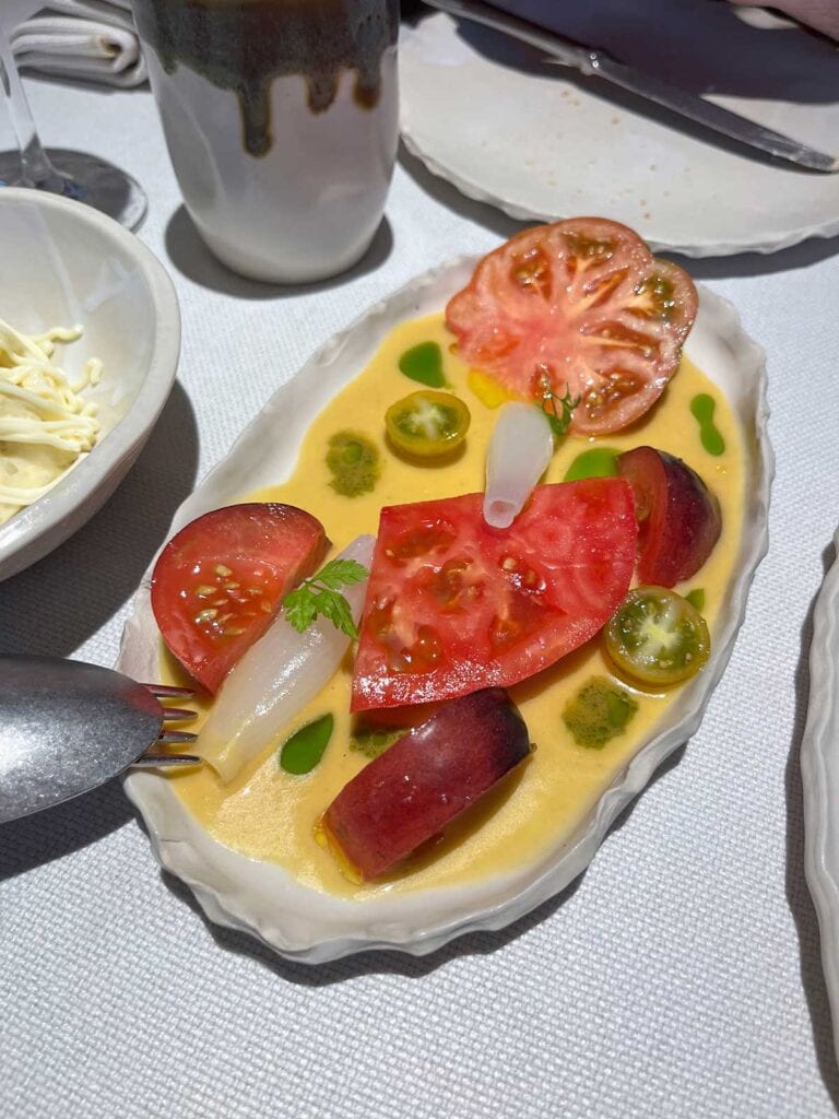 A close up photo of a tomato salad from Tragabuches restaurant.