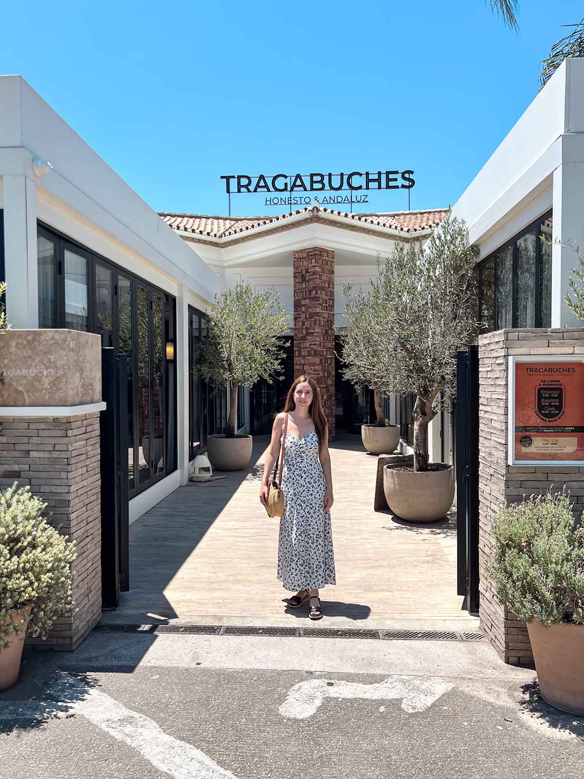 Cristina at the entrance of Tragabuches restaurant in Marbella, Spain.