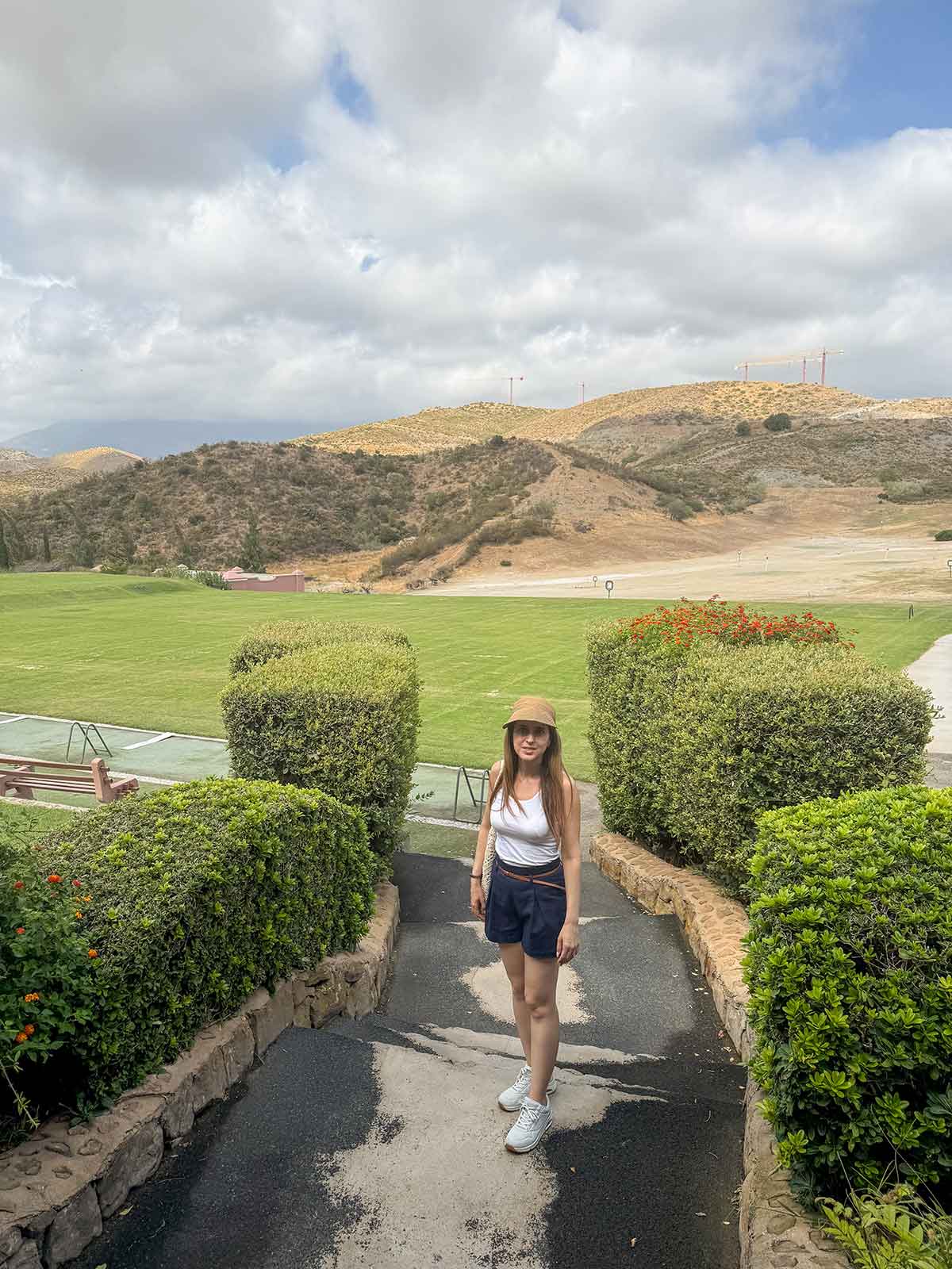 Marbella in November: 14 Things to Do, Weather + Local Tips 23 Cristina ready to play golf in Villa Padierna, Benahavis, Marbella.