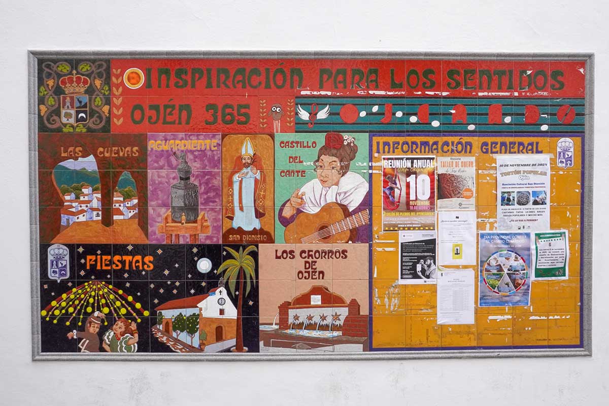 A tiled wall with Ojen main sights.