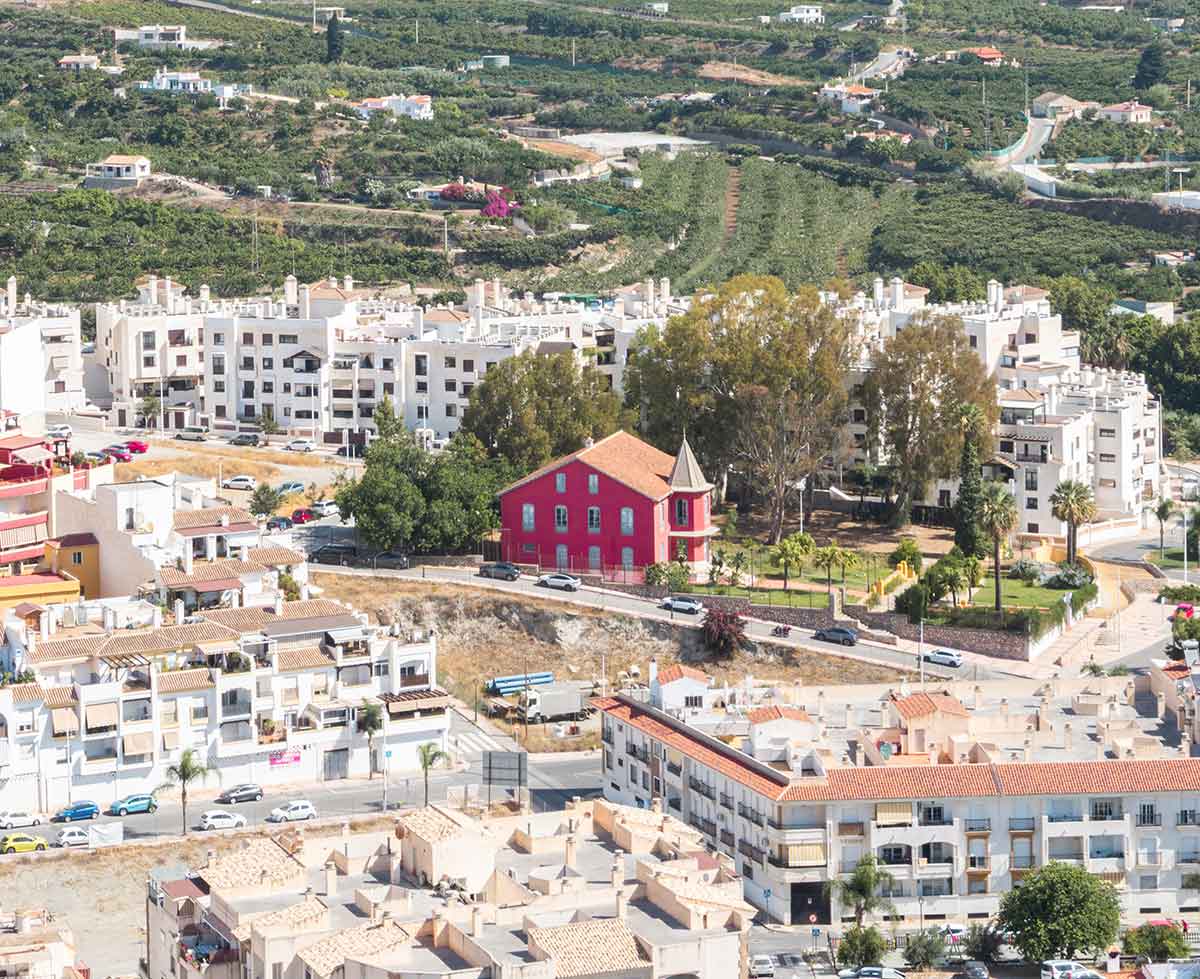 Casa Rosa, a red building in Salobreña.