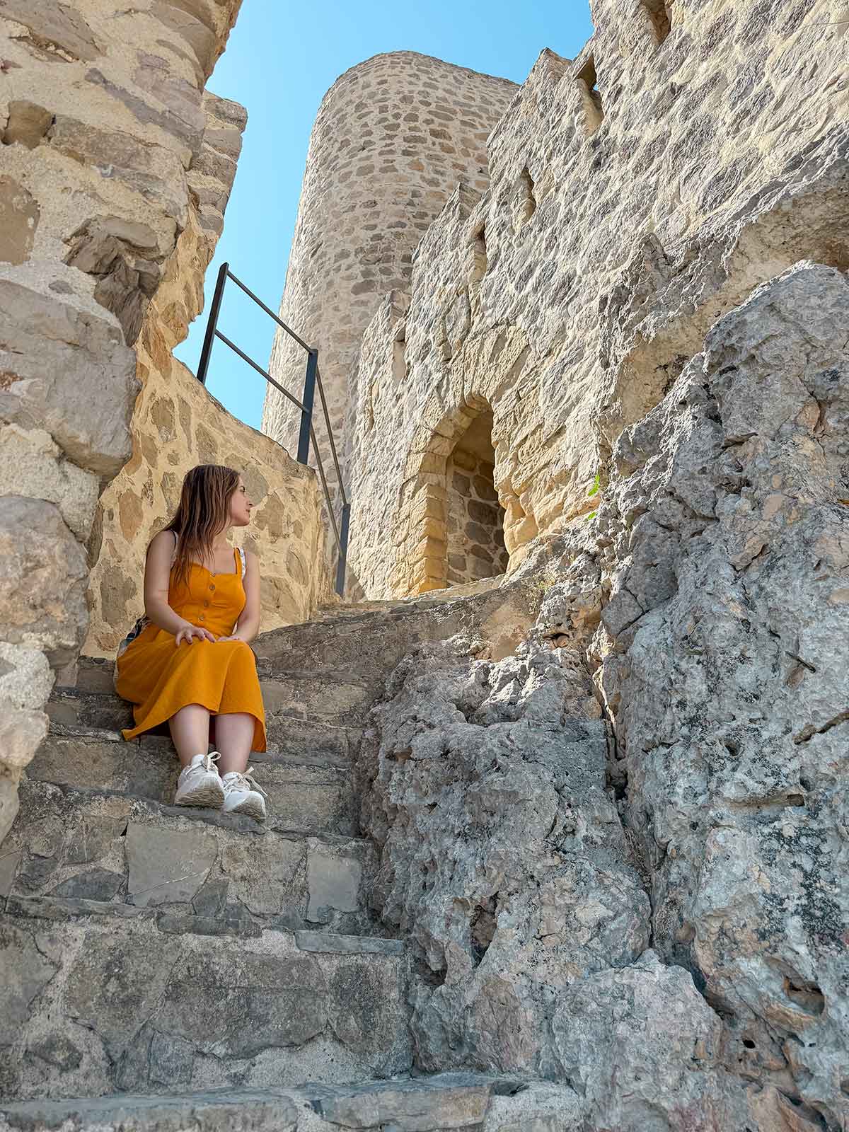 Cristina sat at the stairs of Olvera Castle.