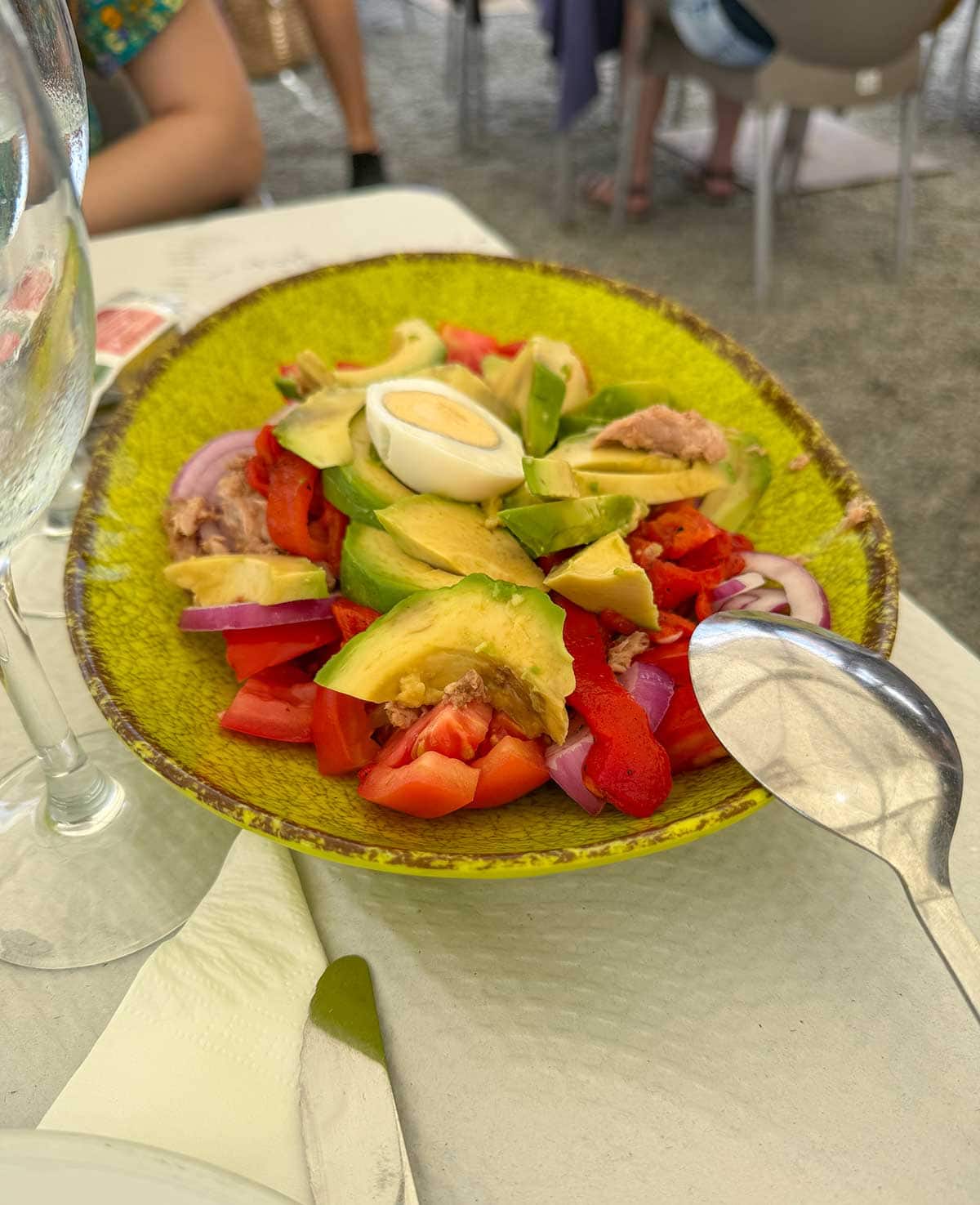 Salad made with avocado, roast peppers, tuna and hard-boiled egg.