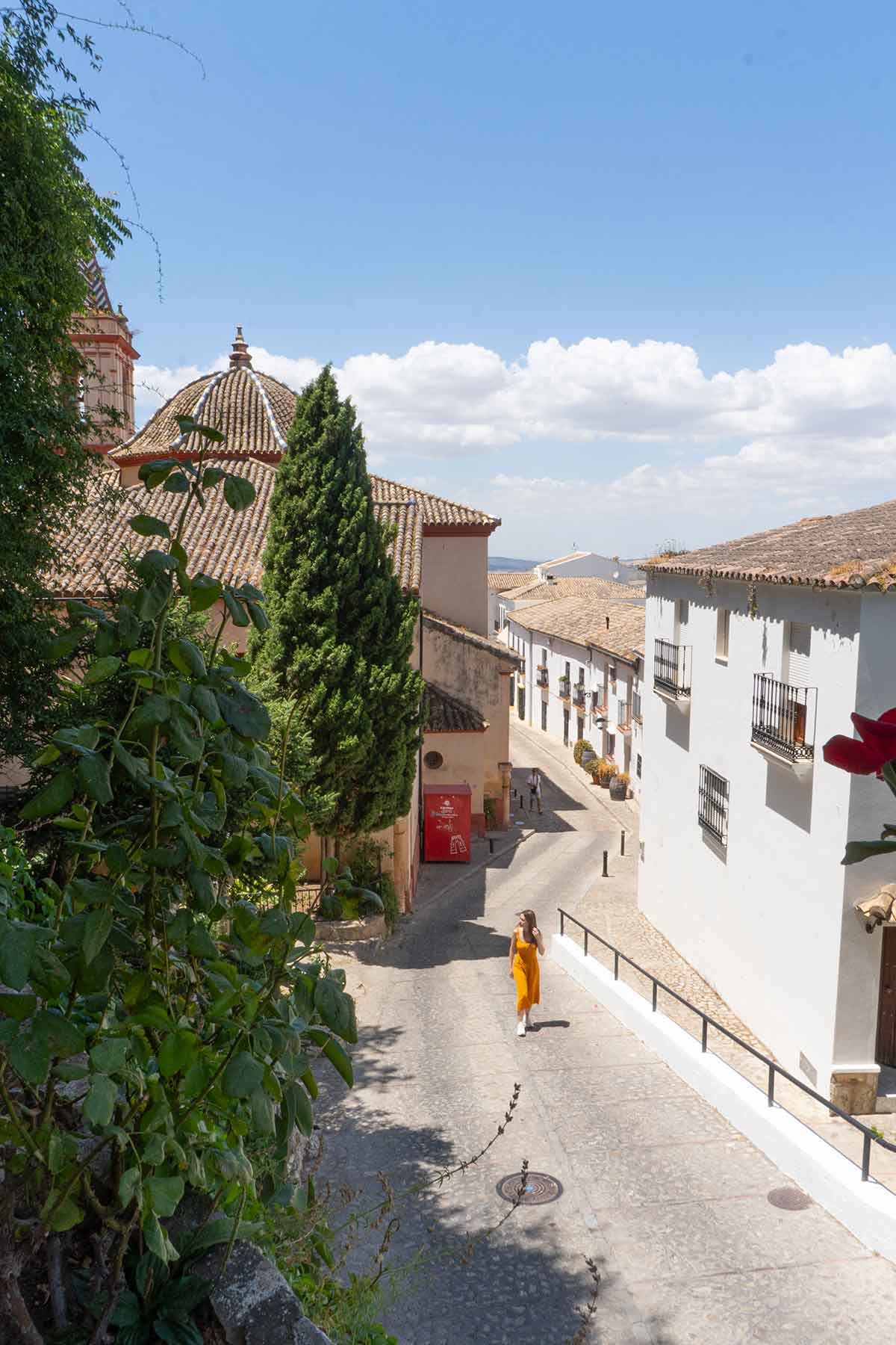 10 Best Things to Do in Zahara de la Sierra 5 A woman walking up a street in Zahara de la Sierra.
