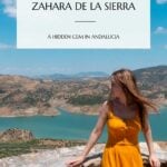 Pinterest pin that shows a woman looking at the reservoir and mountian views in Zahara.