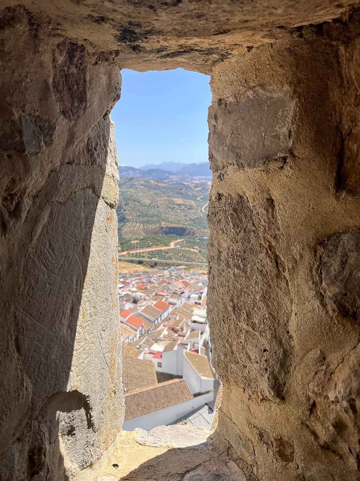A peekaboo view of Olvera town from a tiny window in the castle.