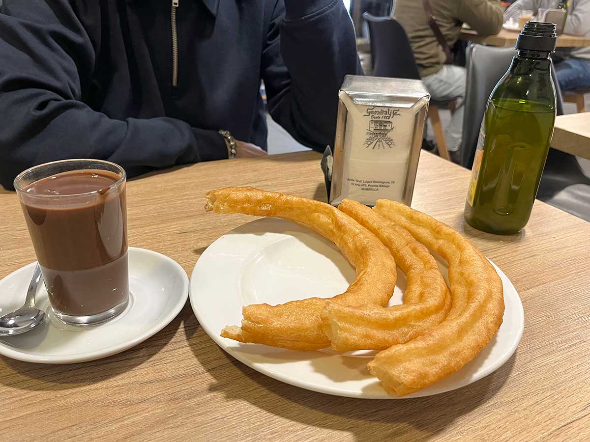 Marbella in November: 14 Things to Do, Weather + Local Tips 5 Churros with Spanish hot chocolate from Churreria Generalife, Marbella.