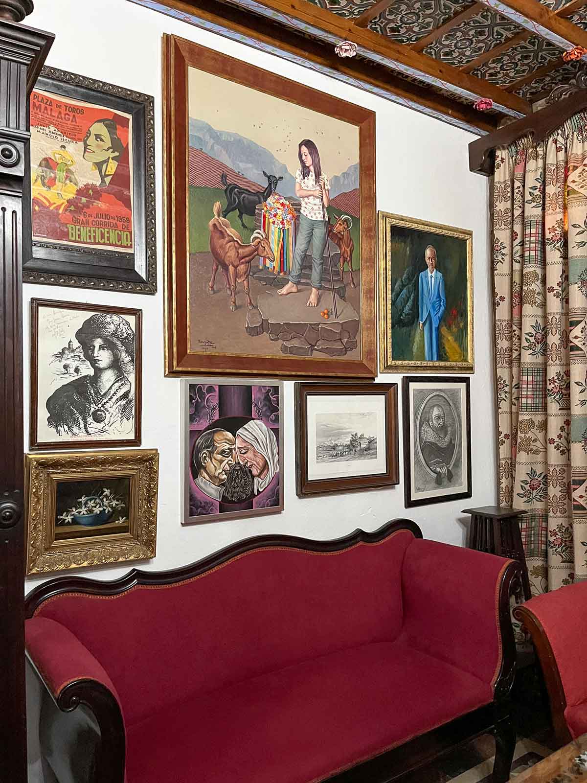 A wall full of paintings inside Casa Museo Axarquia.