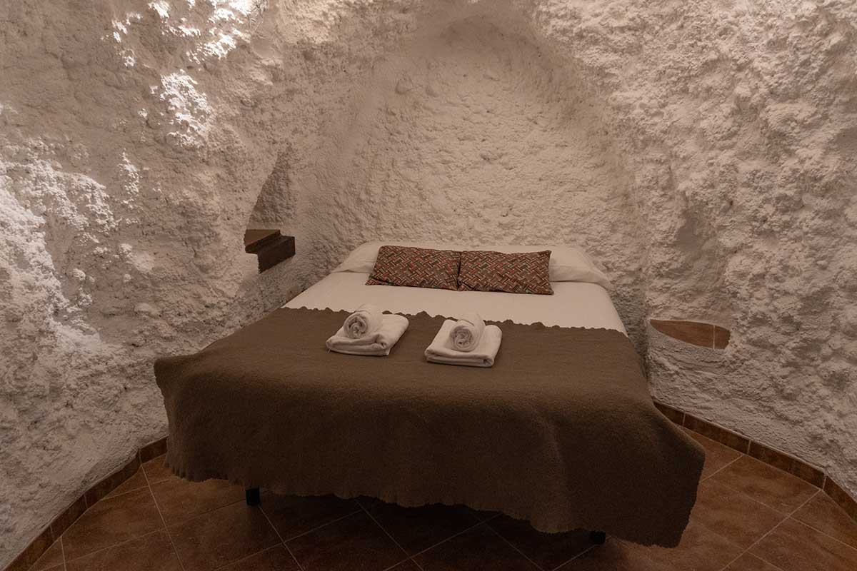 Bedroom inside one of the cave houses in El Atochal.