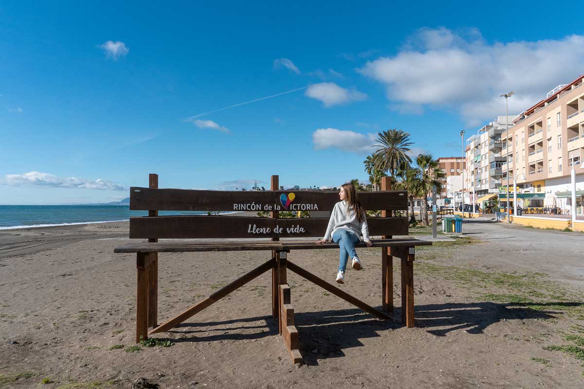 Cristina sat in the giant bench in Rincon de la Victoria Beach.