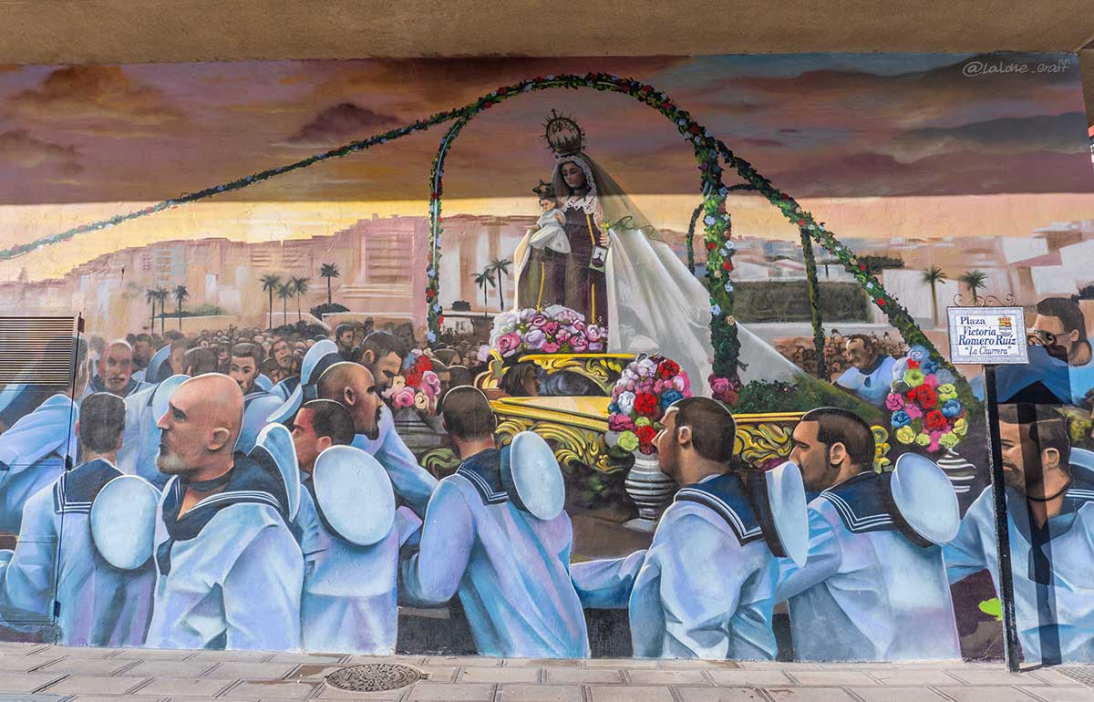 A painting of a religious parade in El Rincon de la Victoria.