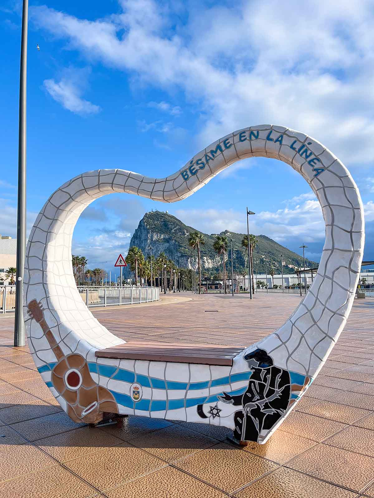 Besame en La Linea bench with views of the Rock of Gibraltar.