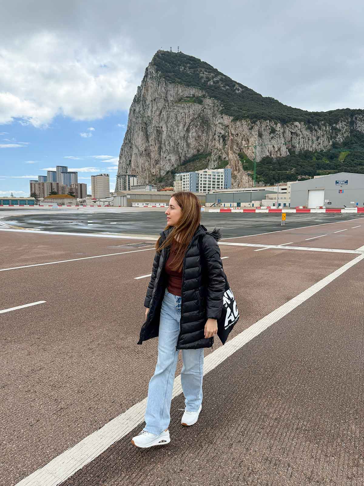 Cristina walking from Gibraltar to La Linea.