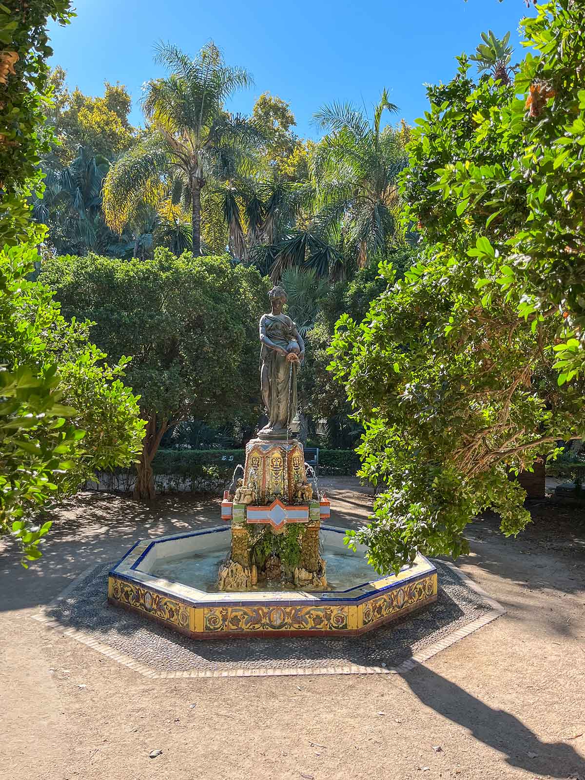 Fountain with sculpture in Malaga Park, Spain.