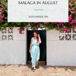 Pinterest pin that shows a woman in a light blue long dress in Pedregalejo and reads "Ultimate Guide to Malaga in August".