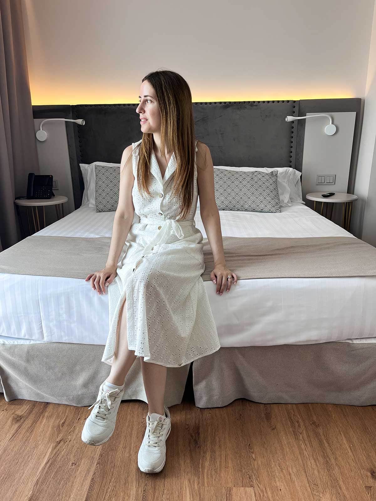 My Review of La Brisa del Mar Hotel, Estepona 10 Cristina sat on the bed in the junior suite at La Brisa del Mar Hotel, Estepona.