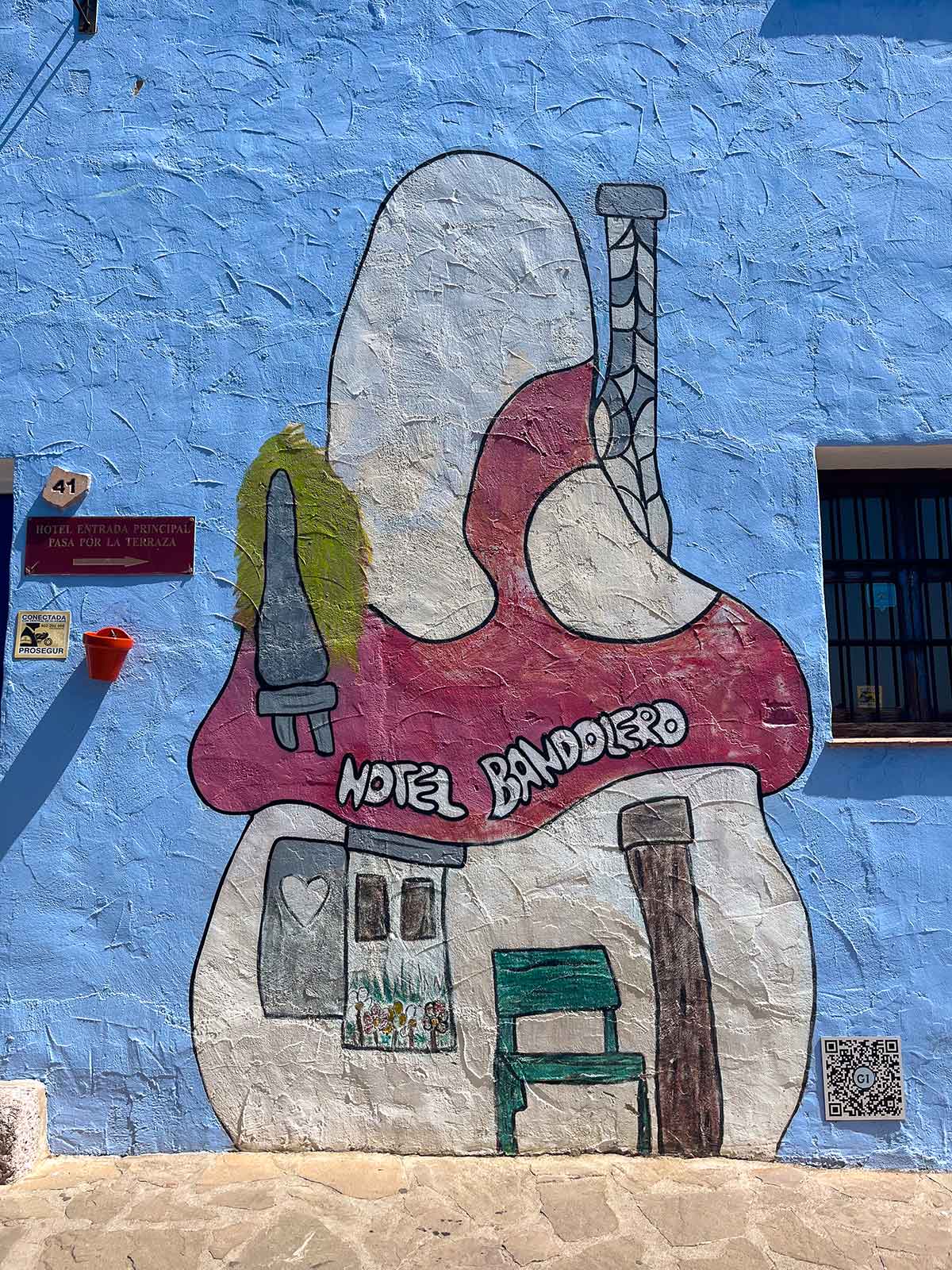 Things to Do in Juzcar, The Blue Village in Malaga 20 Wall painting of Hotel Bandolero Juzcar.