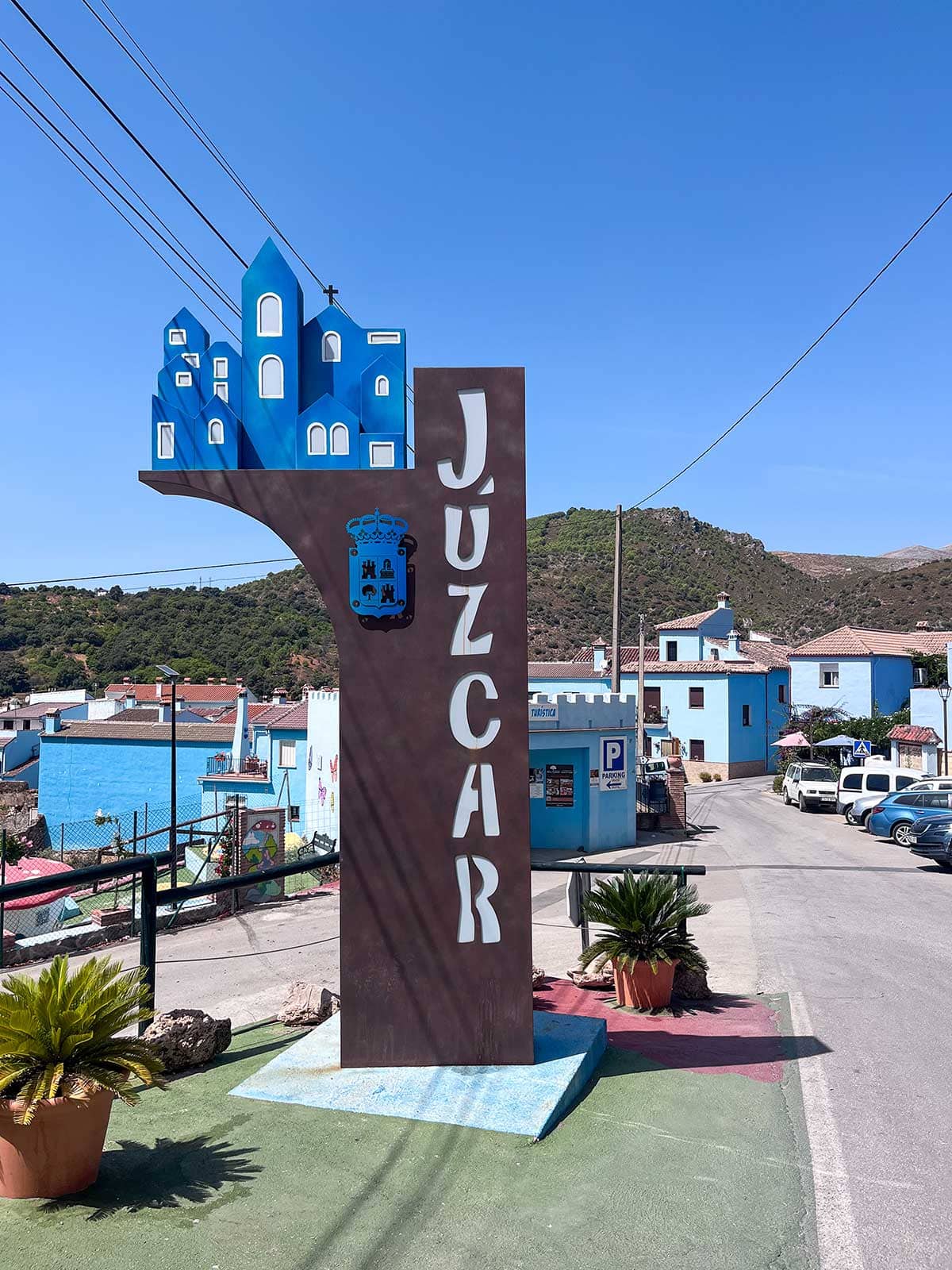 Things to Do in Juzcar, The Blue Village in Malaga 3 The sign of Juzcar at the beginning of the village.