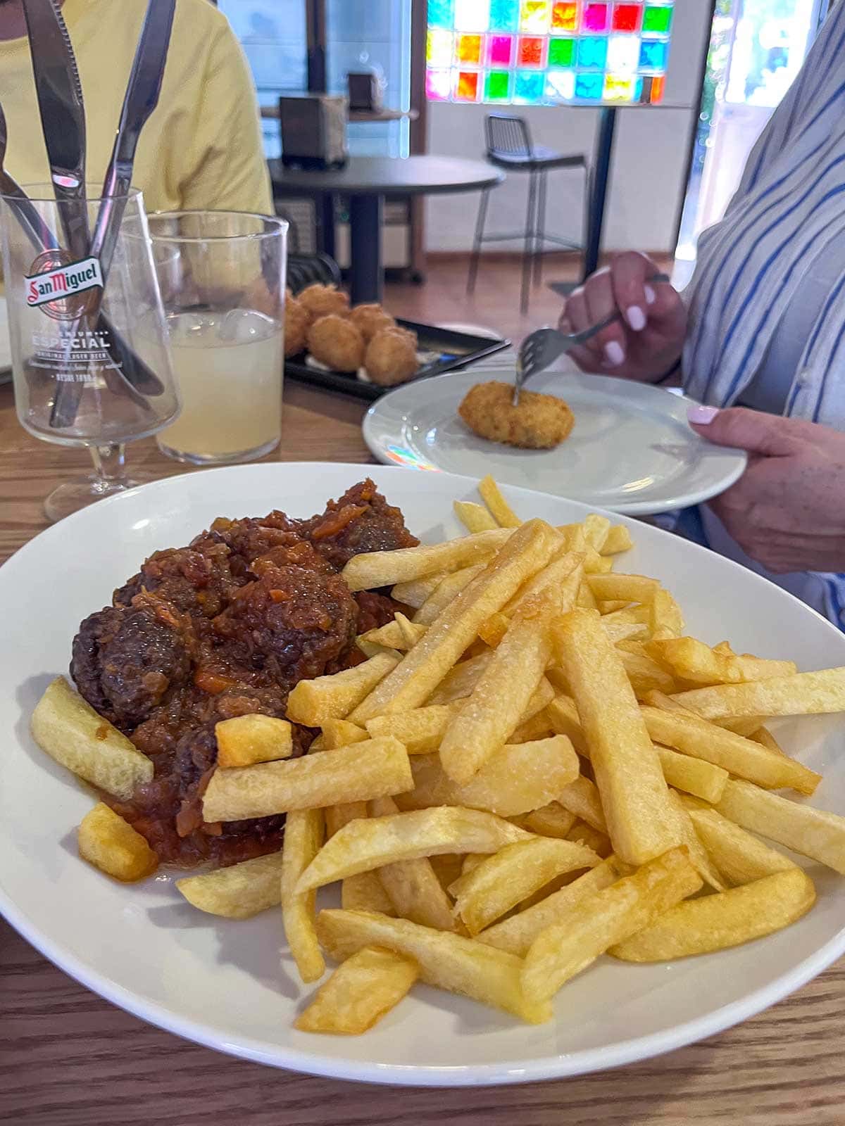 Things to Do in Juzcar, The Blue Village in Malaga 6 Homemade meatballs and chips at Hotel Bandolero restaurant in Juzcar, Malaga.