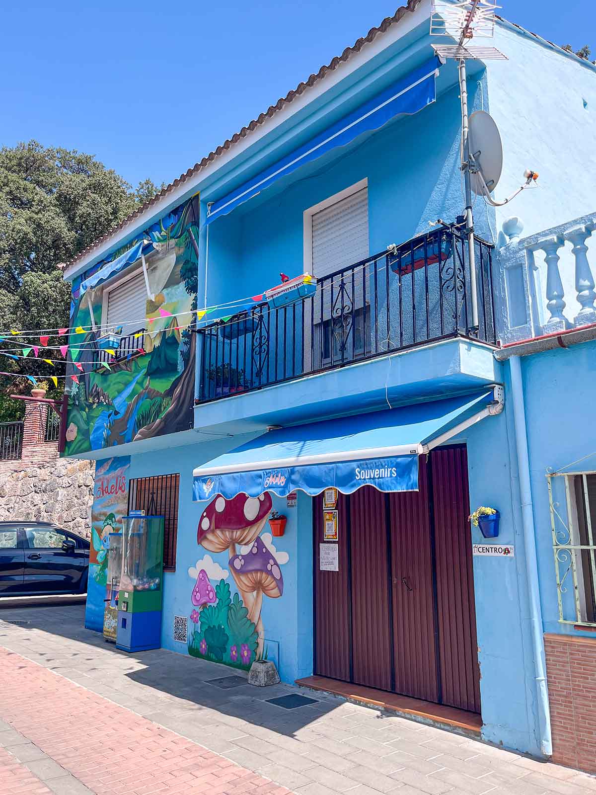 Things to Do in Juzcar, The Blue Village in Malaga 13 Milagros souvenir shop in Juzcar, the blue village in Malaga, Spain.
