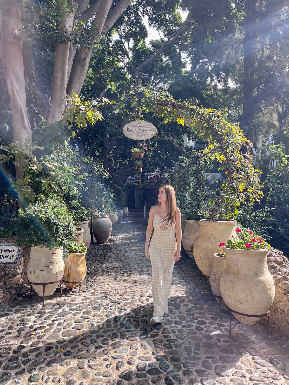 Cristina walking at the Puente Romano beach resort in Marbella, Spain.