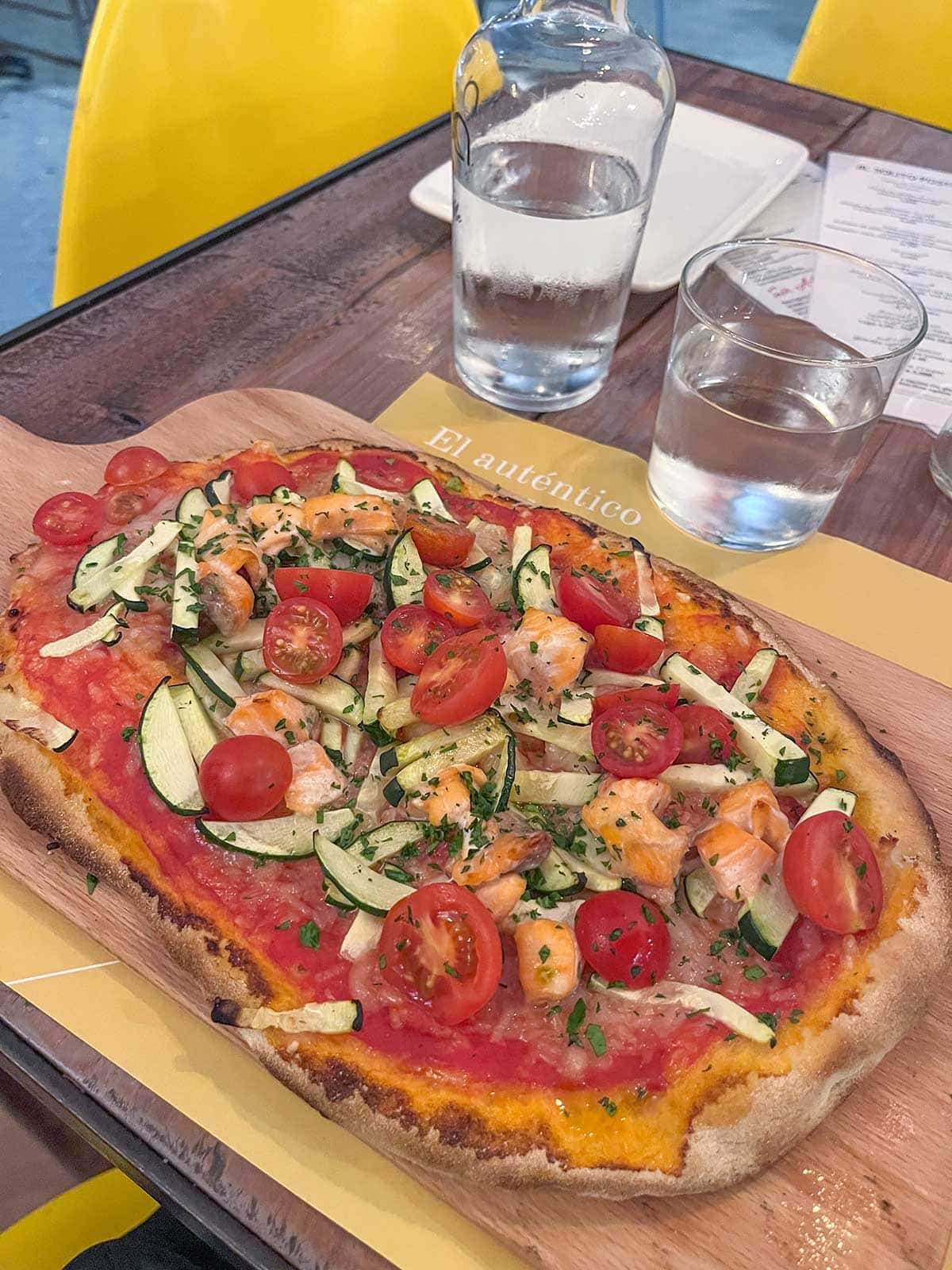 Ultimate Guide to Gluten-Free Seville 5 Gluten-free pizza with courgette, salmon and tomatoes at Al Solito Posto in Seville, Spain.
