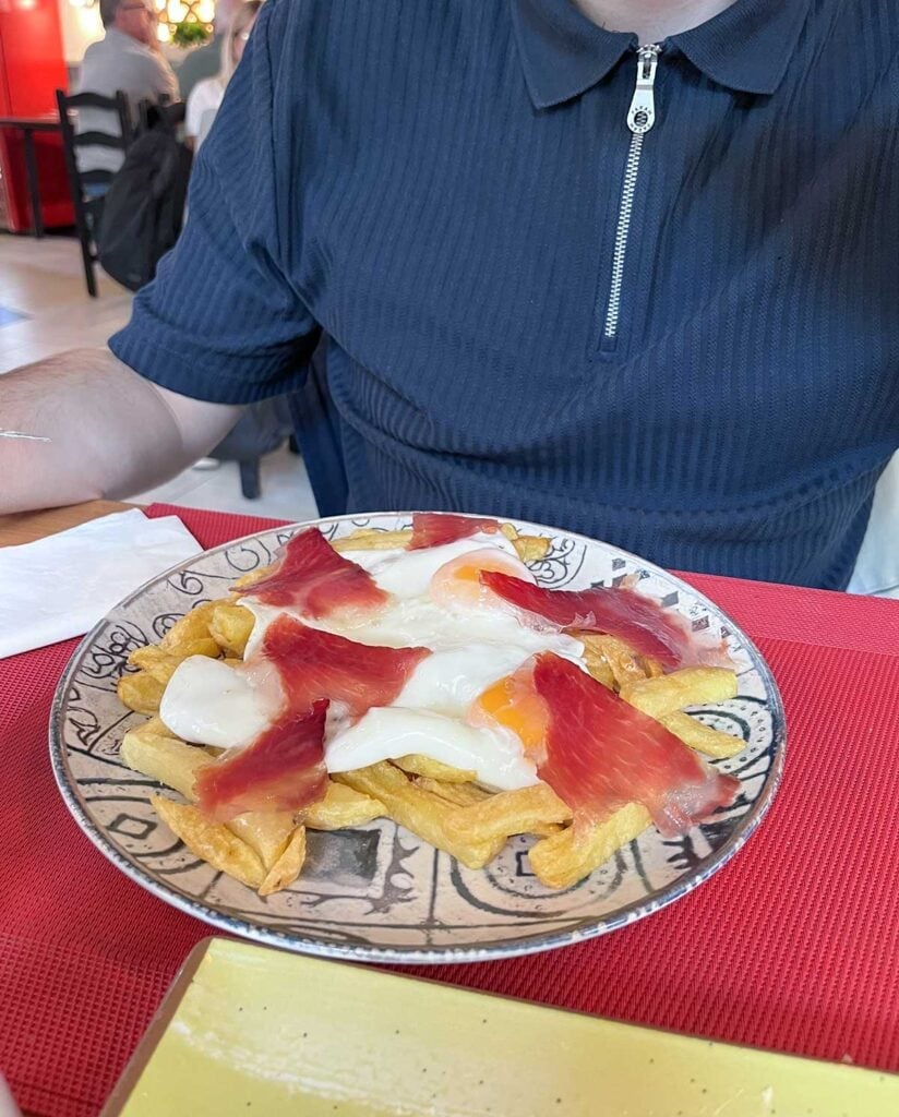 Ultimate Guide to Gluten-Free Seville 11 Huevos rotos at Postigo 10 restaurant in Seville.